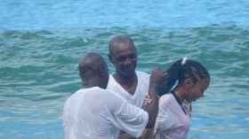 Pastor Albert Best  baptises a candidate