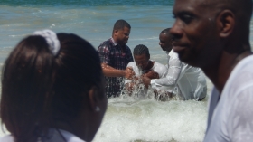 Pastor Dexter Daly baptises a candidate