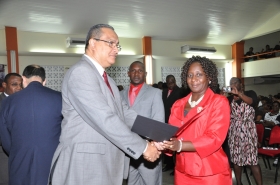 Regional Director Dr Carlos Saenz presents Pastor Hazel Ann George with her Ordination Credentials at the COTN Trinidad & Tobago District Ordination Service 2014