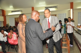 Regional Director Dr Carlos Saenz presents Pastor Arnold Hargreaves with his Ordination Credentials at the COTN Trinidad & Tobago District Ordination Service 2014