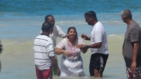 Pastor Chaitram Babooram  baptises a candidate 2