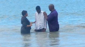 Pastor Angelique Isaacs  baptises a candidate