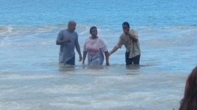 Pastor Peter Stroude baptises a candidate