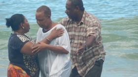 Pastor Alicia Baptiste  baptises a candidate