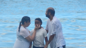 Pastor Vilma Mohammed baptises a candidate