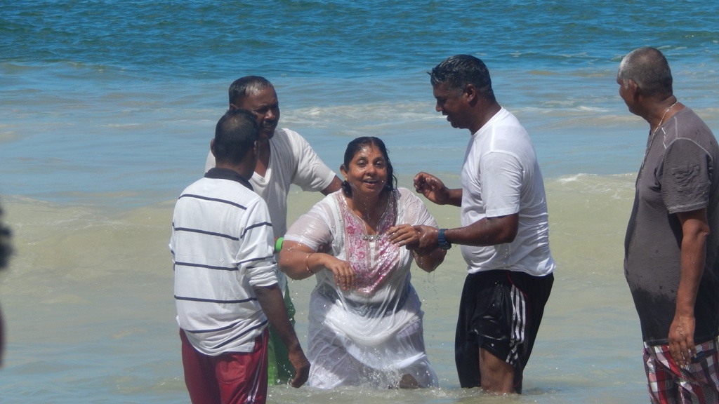 Pastor Chaitram Babooram  baptises a candidate 2